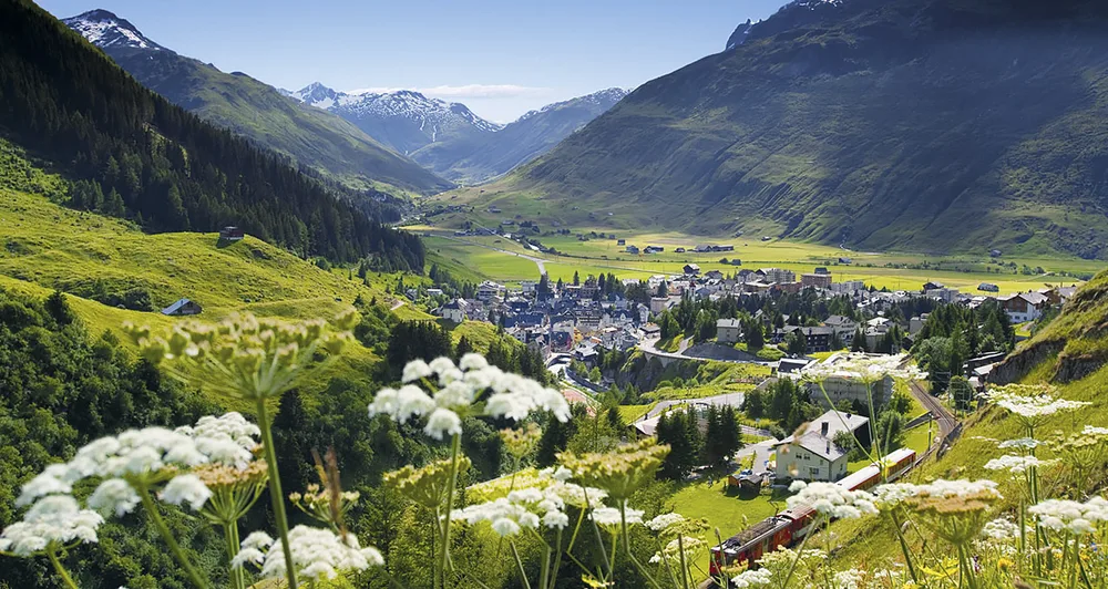 The valley at Andermatt with mountains on both sides