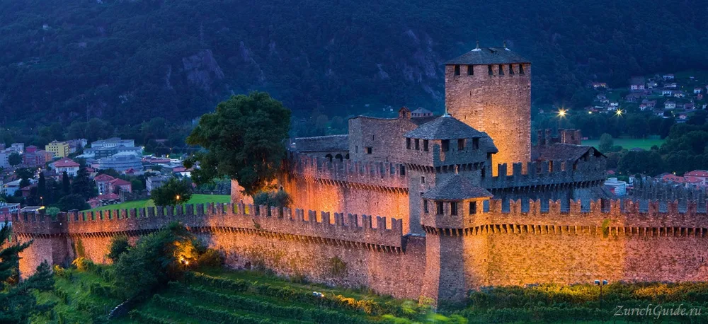 The castle of Montebello above Bellinzona, floodlit at dusk