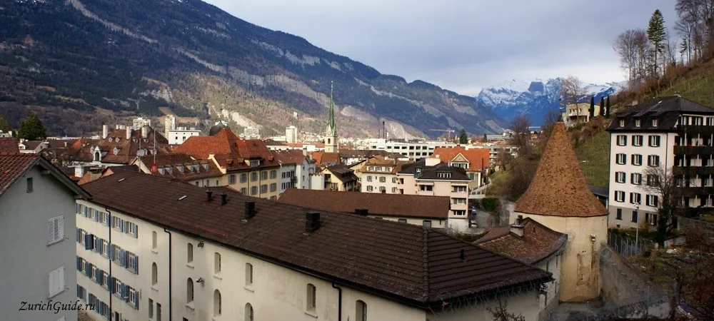 The roofs of Chur old town below the mountains