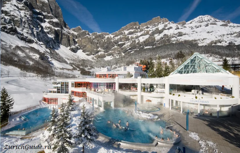 Outdoor thermal pools at Leukerbad below the cliffs