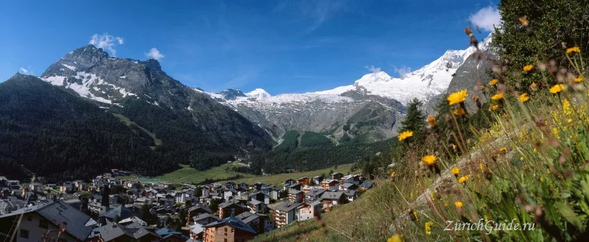 Saas-Fee below its ring of high peaks
